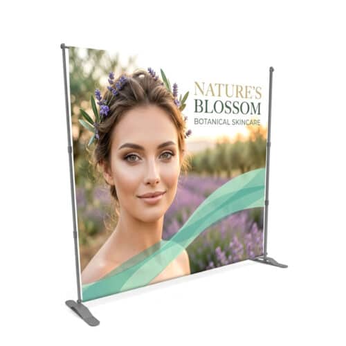 A professional custom 10'x8' step and repeat backdrop with logos, mounted on a sturdy stand for red carpet events.